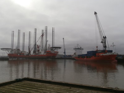 orange hulls in the harbour.JPG